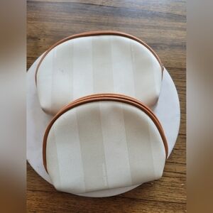 Allan Edward ivory striped makeup pouches
